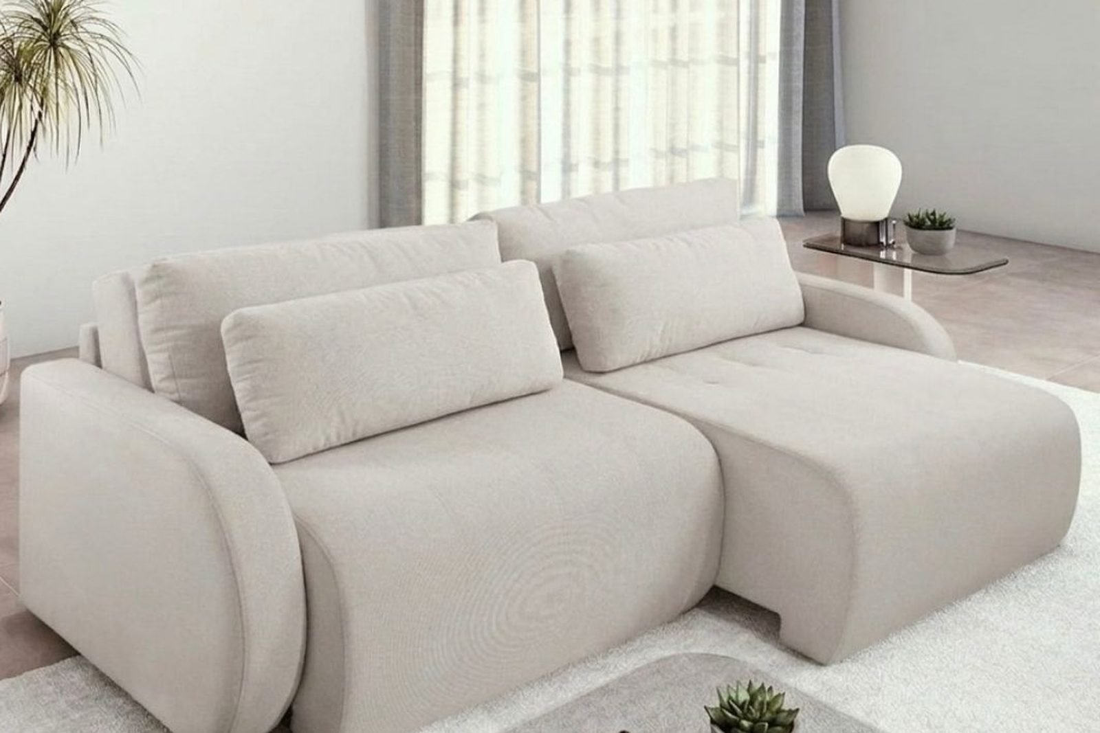 Sofá Cama Belina em tecido bege, com o assento retrátil aberto, numa sala clara